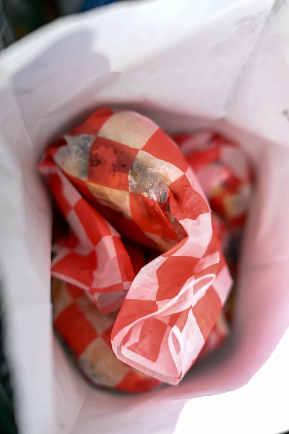 Wrapped 7th Street Burger cheeseburgers packed for catering and large group orders